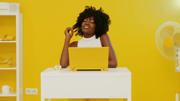 Portrait Smiling African Woman Yellow Room alt