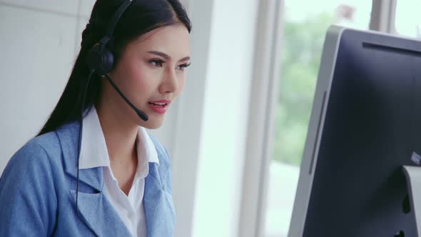 Customer Support Agent or Call Center with Headset Talking to Customer on Phone alt