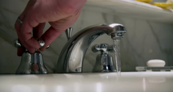 Hotel faucet in slowmotion