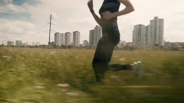 Running Woman Workout. Fit Woman Cardio Training. Runner Workout On Grass Field. Marathon Jogging. alt