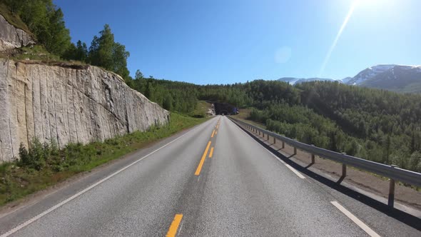 Vehicle Pointofview Driving a Car on a Road in Norway alt