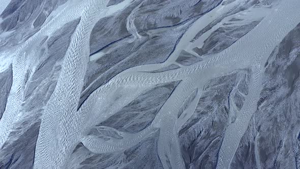 Abstract Aerial Top Down View Perspective of Glacial Melt Water River Streams in Iceland alt