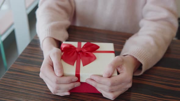 The Girl Received a Gift on a Date or at a Celebration of the Holiday