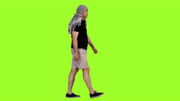 Man Tourist Walking in Arabic Scarf