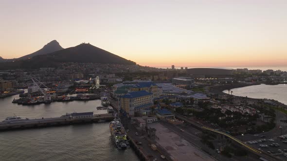 Aerial Footage of Buildings on Victoria and Alfred Waterfront at Twilight alt