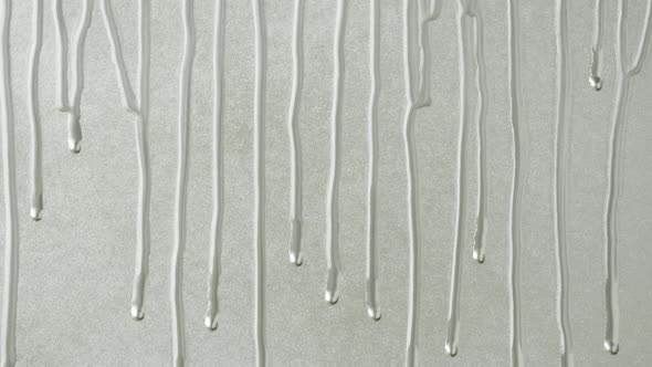 Silver Paint Background Color Tint Drops on Grey Wall Closeup alt
