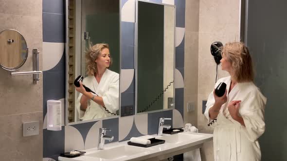 Beautiful Lady Drying Her Hair in the Bathroom alt