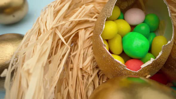 Easter Egg with Colorful Candies in a Basket Close Up