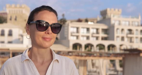 Woman Tourist Relaxation on Rocky Beach alt
