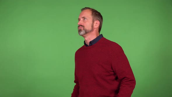 A Middleaged Handsome Caucasian Man is Angry and Shouts  Green Screen Background