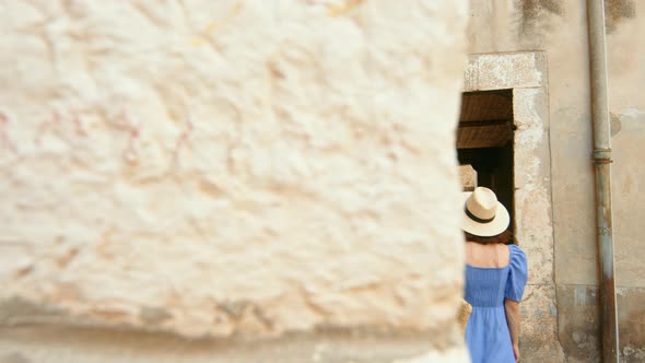 A young girl walking along the city street. Sibenik alt