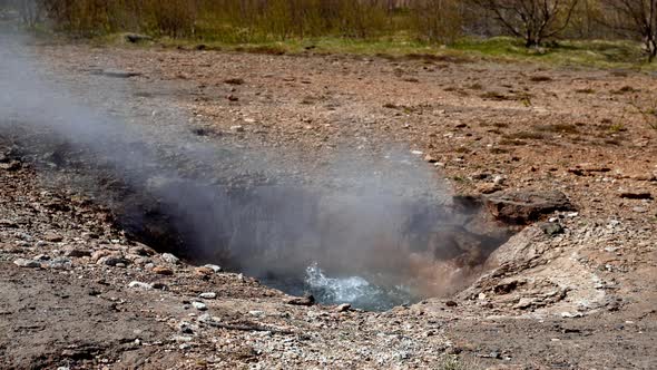 Steam Emitting From Strokkur Geyser in Iceland alt