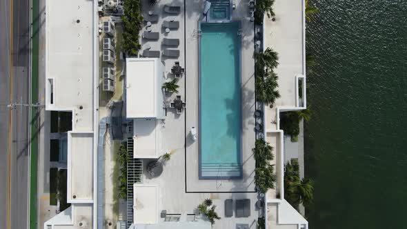 Drone Flying Over Rooftop Pool alt