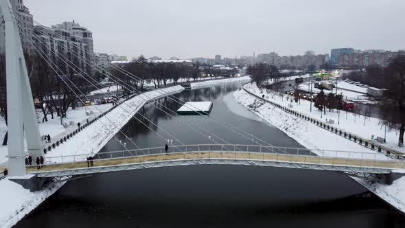 Aerial bridge on winter river in Kharkiv city