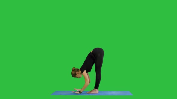 Young Woman Doing Yogic Sun Salutation Pose on Mat on a Green Screen, Chroma Key alt