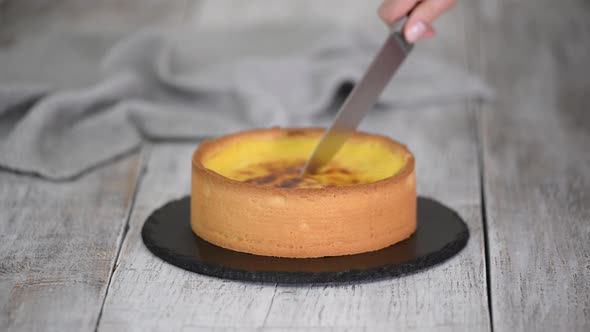 Cutting French Flan Patissier with Kitchen Knife