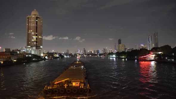 Top View of A Large Cargo Barge Moves on River at Summer Night alt