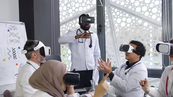 Medical Male and Female Team Using Virtual Reality Technology to Study of Modern Medicine alt