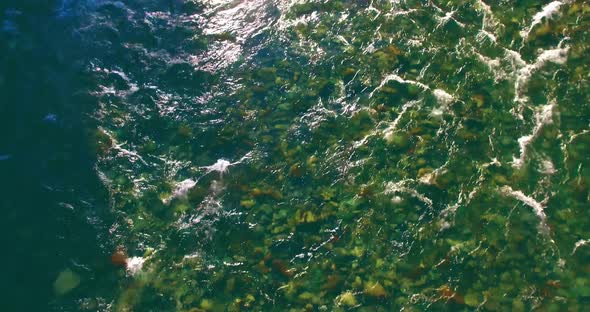 Low Altitude Flight Over Fresh Fast Mountain River with Rocks at Sunny Summer Morning alt