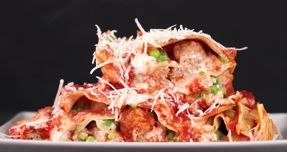 Seasoning lasagna with parmesan cheese