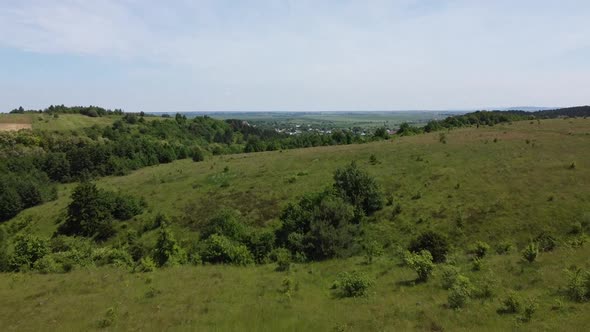 Aerial drone view of a flying over the rural agricultural landscape. alt