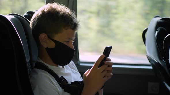 Teenager Sits on Bus