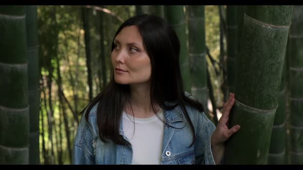 Woman Looks Around Warily in the Bamboo Grove