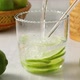 Fresh green limes and glass of water with lime slices as a healthy drink  - VideoHive Item for Sale