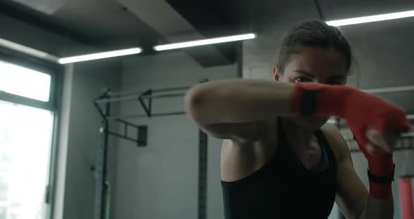 Mixed Martial Art Fighter Woman Does Shadow Boxing to the Camera in the Fight Club Female Fighter is alt