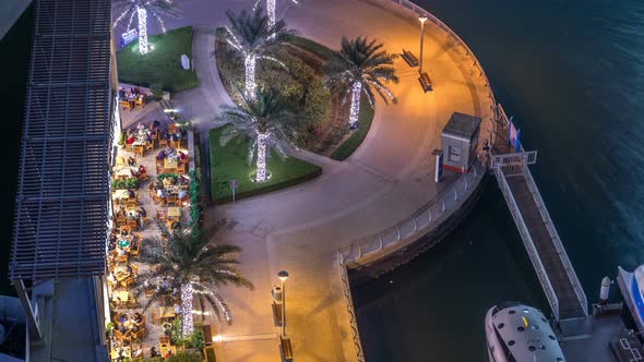 Modern Embankment Timelapse with Bar Cafe and Restaurant in Famous Dubai Marina alt