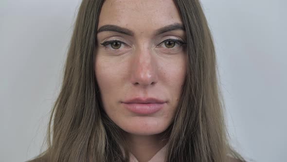 Close Up of Woman s Face Female Opening Her Beautiful Green Eyes Attractive Brunette alt