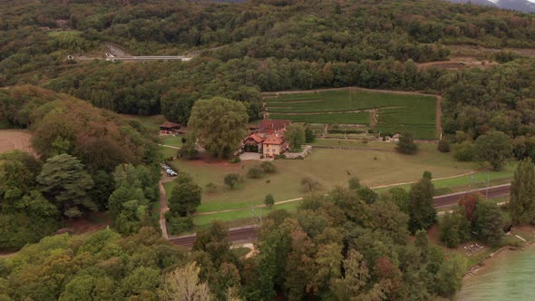 Aerial of distant monumental buildings in rural Switzerland alt