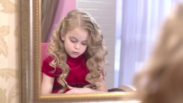 Thoughtful Child Reading Magazine alt