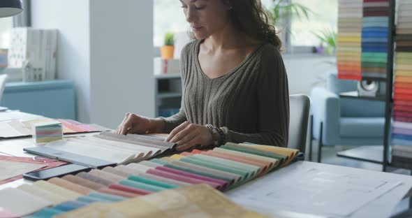 Professional decorator choosing fabric samples