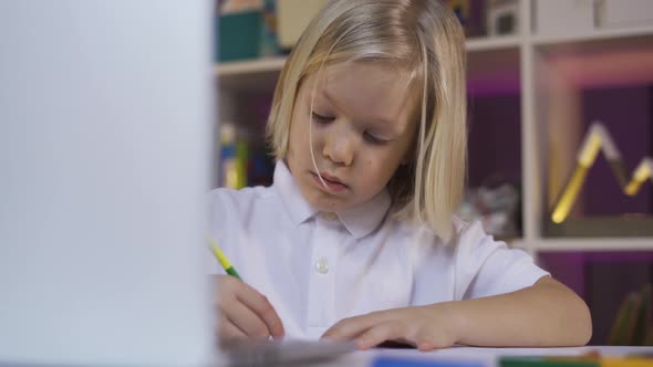 Distance Learning Due Quarantine, Online Education. A Small Teen Boy Learning on Computer at Home