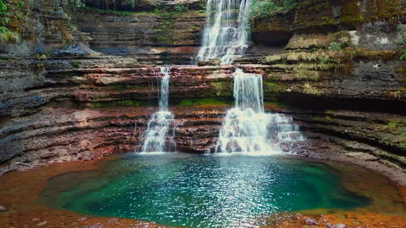 Camera approaches lower pool at Elephant Falls alt