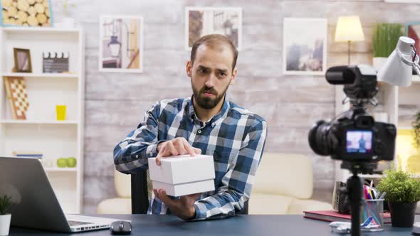 Famous Young Influencer Recording the Unboxing of a Phone alt