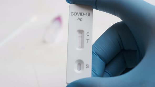 Demonstration of Negative Rapid Antigenic Covid19 Test By Doctor in Rubber Gloves alt