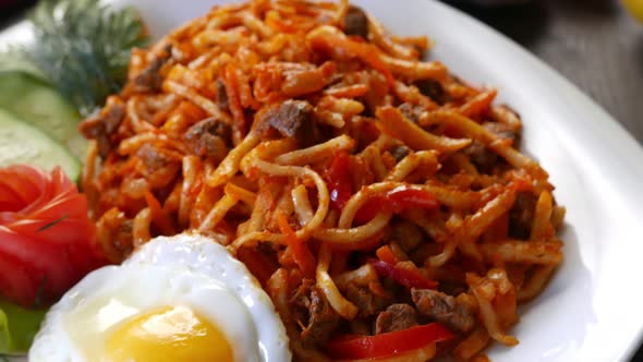 Roasted Noodles with the Scrambled Egg on a Plate  Asian Food alt