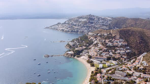 Aerial of Famous Coastal Mediterranean Town of Roses Spain alt
