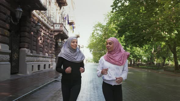 Two Muslim Ladies in Sportswear and Colorful Hijabs alt