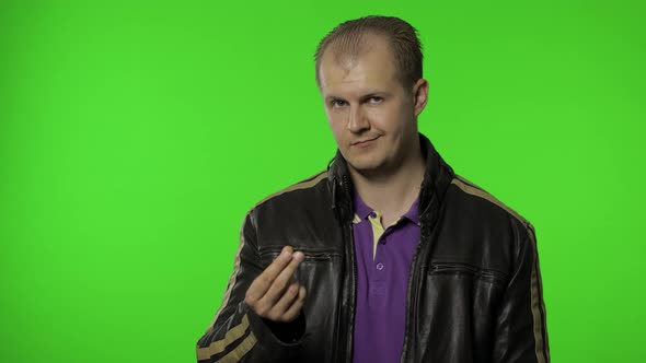 Rocker Man Asking for Salary Increase, Smiling, Showing Money Gesture, Needs Cash, Credit, Loan alt