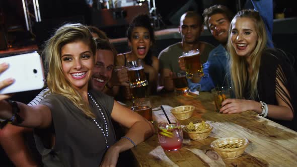 Group of friends taking a selfie alt