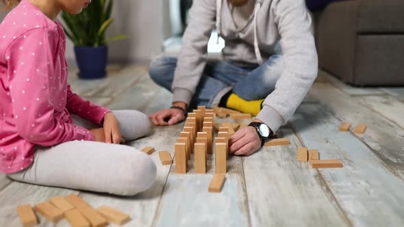 Father and Happy Daughter Play Wooden Blocks Friendship