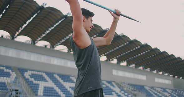 Javelin Throw Back Athlete Thrower in Track and Field Event. Undefined Athlete Javelin Throwing alt