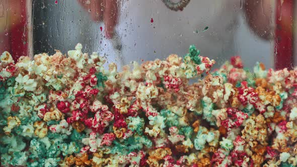The Chef Mixes Colorful Popcorn While Cooking alt