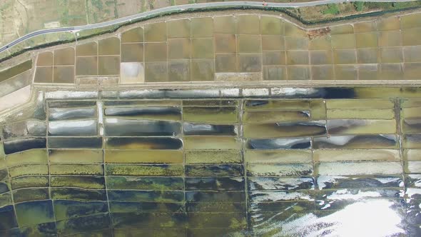 View from above of road passing salt fields of Pag island, Croatia alt