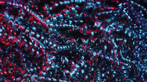 Shiny Metal Shavings Illuminated By Red and Blue Neon Lights alt