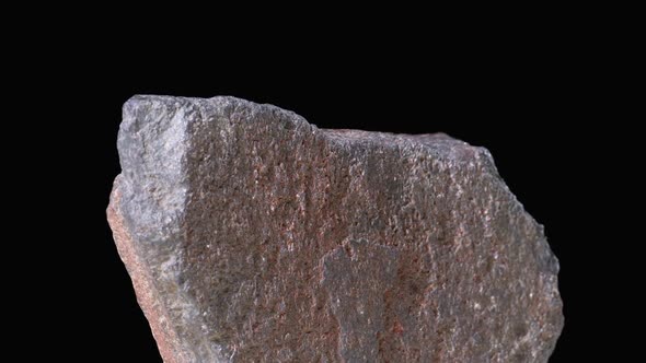 The Stone Rotates on a Black Background alt