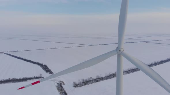 Wind Machine Turns Against Fields Covered with White Snow